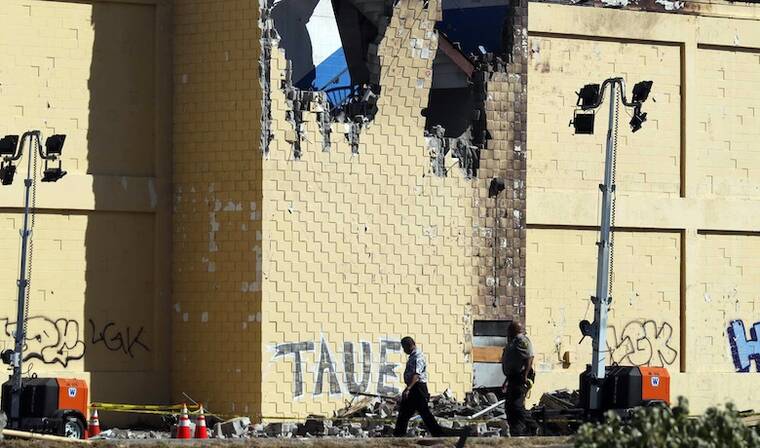 JAMM AQUINO / JAQUINO@STARADVERTISER.COM
The damaged cargo building is seen after a Kamaka Air plane crashed into the structure near Daniel K. Inouye International Airport in Honolulu Tuesday afternoon, killing two young pilots.