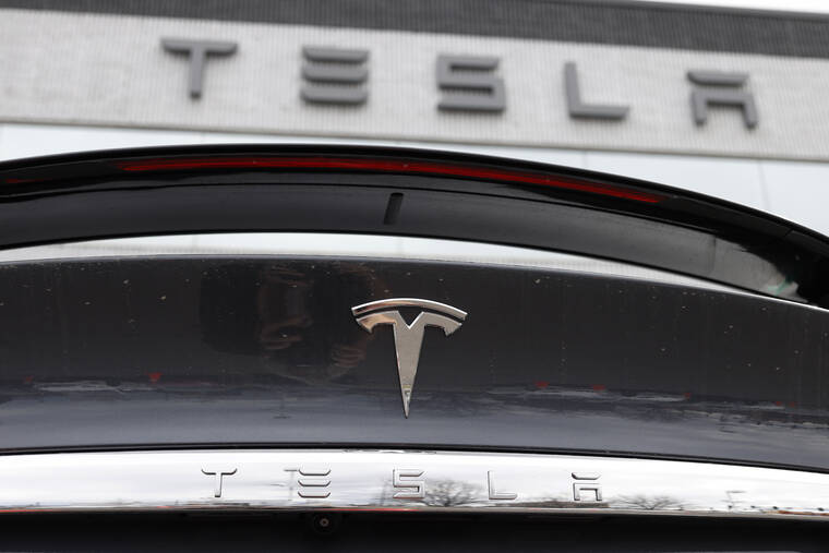 ASSOCIATED PRESS
The Tesla company logo shines off the rear deck of an unsold 2020 Model X at a Tesla dealership, in April 2020, in Littleton, Colo. Tesla is recalling more than 2 million vehicles across its model lineup to fix a defective system thats supposed to ensure drivers are paying attention when they use Autopilot. Documents posted by U.S. safety regulators say the company will send out a software update to fix the problems.