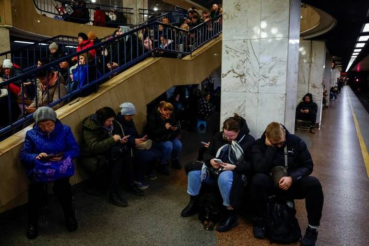 REUTERS/ALINA SMUTKO
People take shelter inside a metro station during a Russian military attack, amid Russias attacks on Ukraine, in Kyiv, Ukraine.