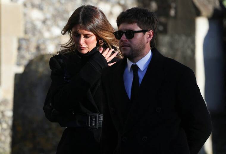 REUTERS/TOBY MELVILLE
Niall Horan and Amelia Woolley depart after the funeral of former One Direction singer Liam Payne at St. Marys Church in Amersham, near London, on Wednesday.