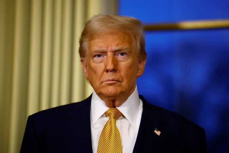 SARAH MEYSSONNIER / POOL PHOTO via REUTERS
President-elect Donald Trump attends a meeting in Paris on Dec. 7.