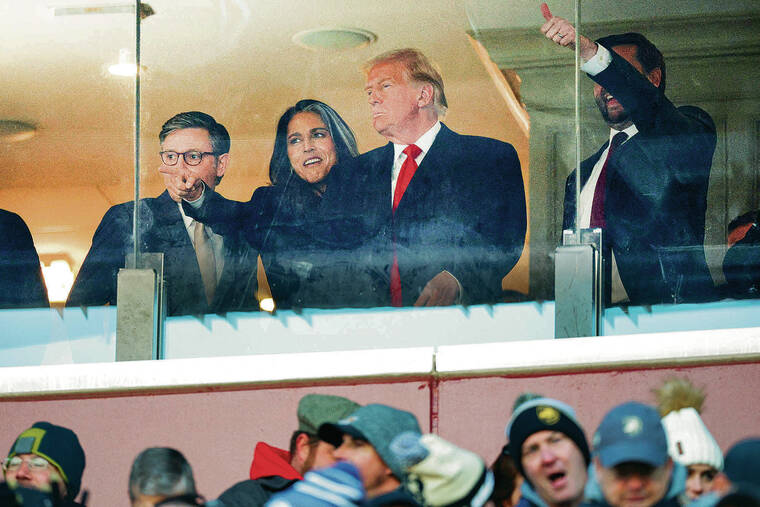 BRIAN SNYDER / REUTERS
U.S. House Speaker Mike Johnson, R-La.; Tulsi Gabbard, director of national intelligence nominee; President-elect Donald Trump; and Vice President-elect J.D. Vance took in the Army-Navy foot- ball game Saturday in Landover, Md.