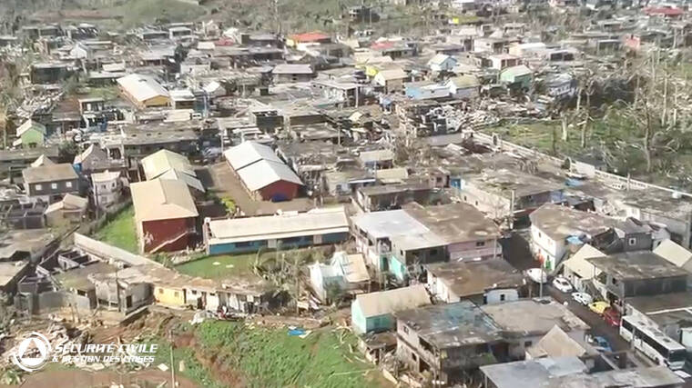 FRENCH CIVIL SECURITY/HANDOUT VIA REUTERS
Damaged houses remain and debris lies on the ground after Cyclone Chido swept through Mayotte, France in this screengrab taken from a handout video obtained by Reuters. Video taken with a drone.