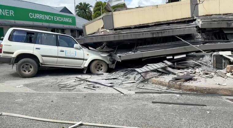 JEREMY ELLISON/VIA REUTERS
A vehicle is trapped beneath a collapsed building following a strong earthquake in Port Vila, Vanuatu, December 17, 2024, in this screengrab taken from a social media video.