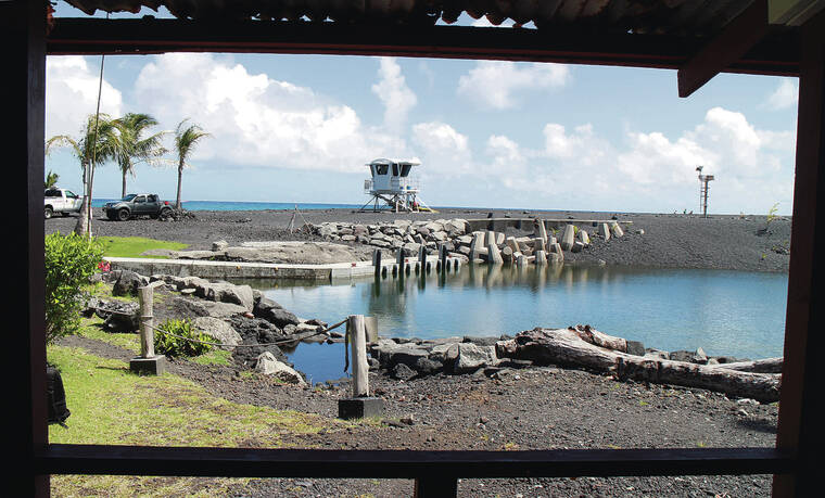 DIANE S. W. LEE / DLEE@STARADVERTISER.COM
Above, remains of the ramp are surrounded by black sand from the 2018 eruption of Kilauea.