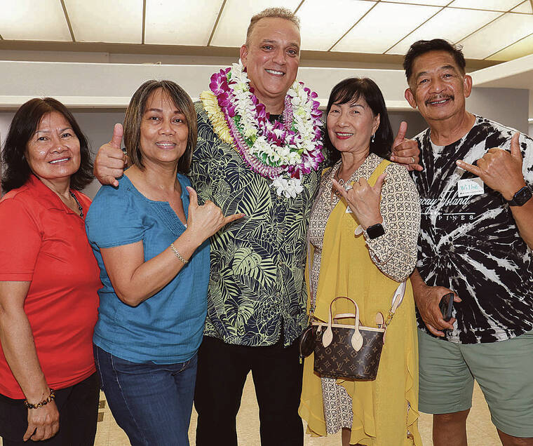 TIM WRIGHT / SPECIAL TO THE TRIBUNE-HERALD
Dr. Kimo Alameda, candidate for Hawaii County Mayor, shares a shaka with supporters on Election Night at Nani Mau Gardens.