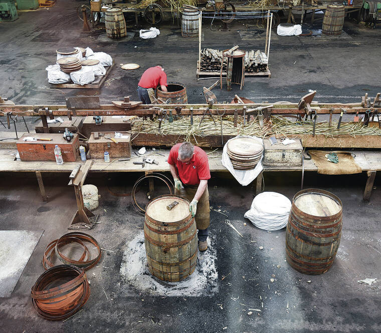 COURTESY CAMERON HEWITT
Workers at Scotlands Speyside Cooperage fashion oak casks for aging Scotch whisky.