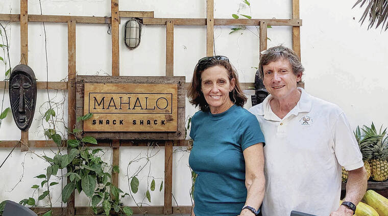 Kelly and Clark Smith of Kailua were taking in the sights in Casco Viejo, Panama, and stopped for refreshment at Mahalo Snack Shack. Kelly Smith said the restaurant in a shady courtyard offers fresh juices and healthy food in Panama City. Photo by a restaurant waiter.